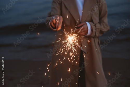 Woman holding a sparkle photo