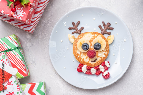 Funny food for kids. Reindeer pancake for  breakfast photo