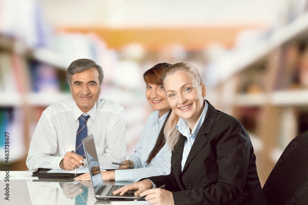 Professional lawyer financial advisor consulting happy family couple clients in modern office. Professional lawyer financial advisor consulting happy family couple clients in modern office.