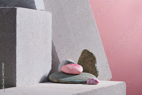 Beautiful hand painted mandala stones lies on the rocks photo