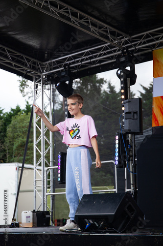 Boy in pride t-shirt on stage