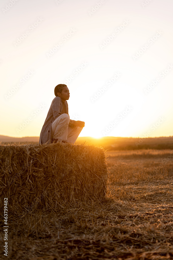 Black woman contemplating sunset in countryside Black woman contemplating sunset in countryside