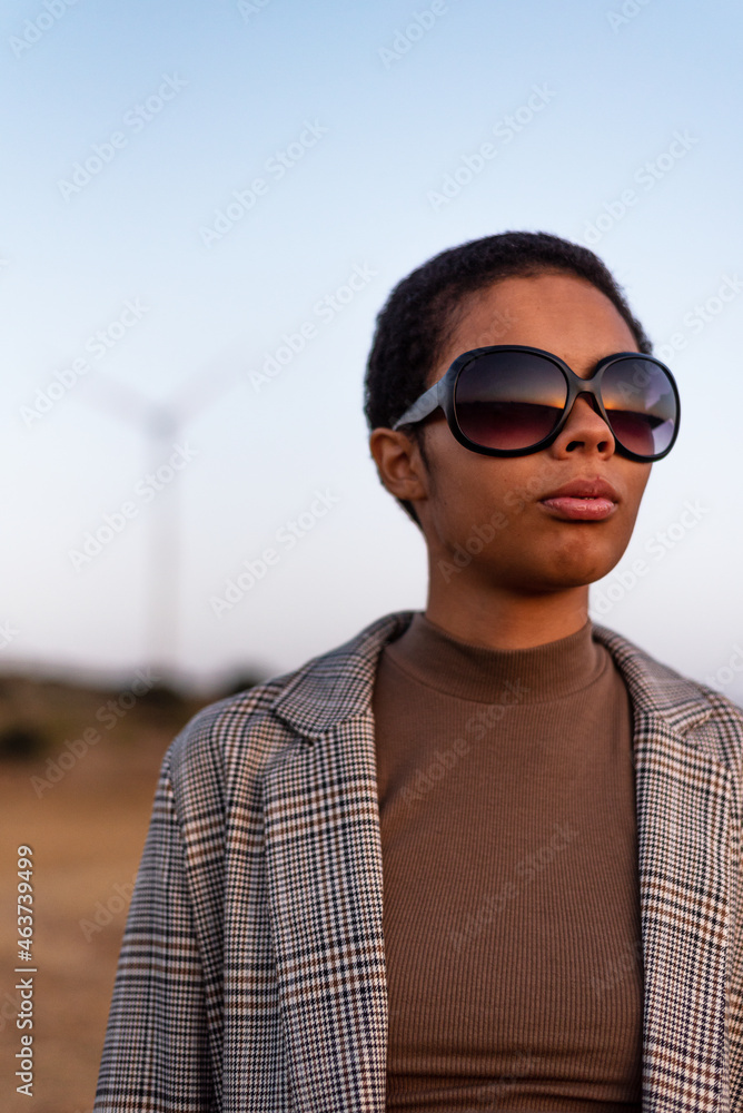 Fashionable black model in autumn field Fashionable black model in autumn field