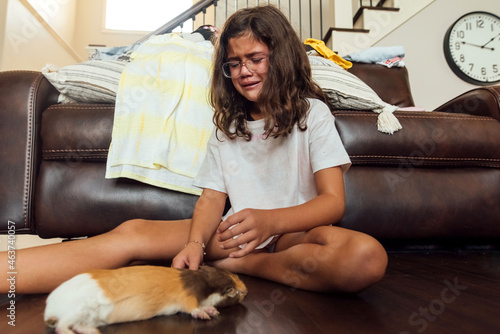 Teen sobbing over the loss of animal.