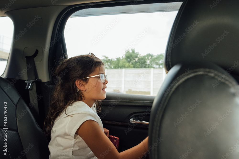 Child staring out the car window. Child staring out the car window.