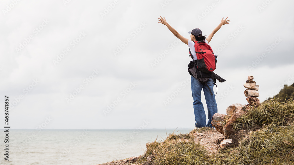 Travelers are enjoying the cliffs with a view of the sea in front. Travel and Lifestyle Concept Travelers are enjoying the cliffs with a view of the sea in front. Travel and Lifestyle Concept