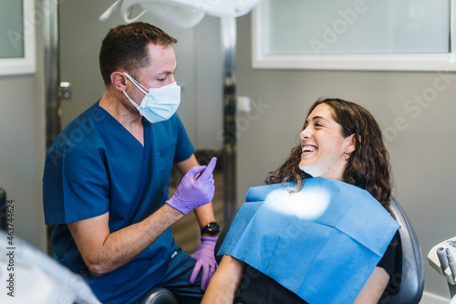Patient and dentist laughing photo