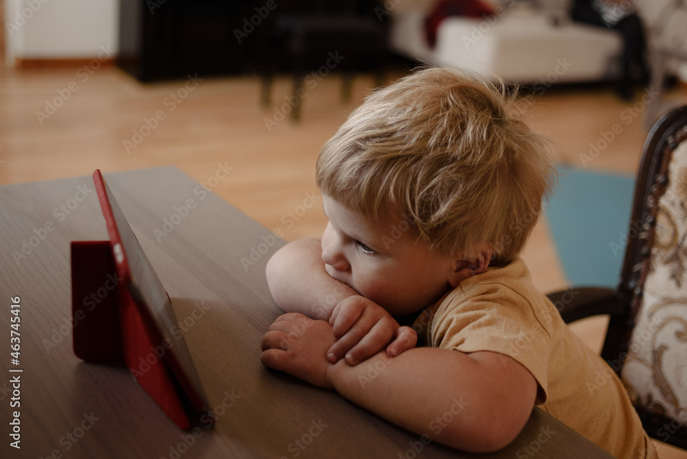 Toddler watching cartoons on a tablet Toddler watching cartoons on a tablet