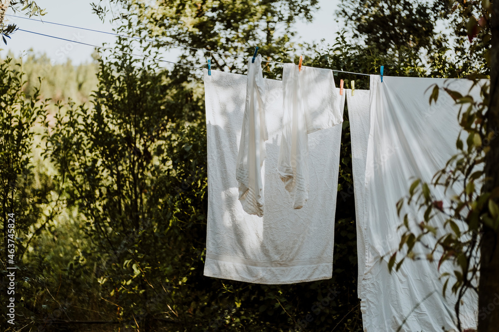 © Vera Lair/Stocksy - Drying sheet outside
