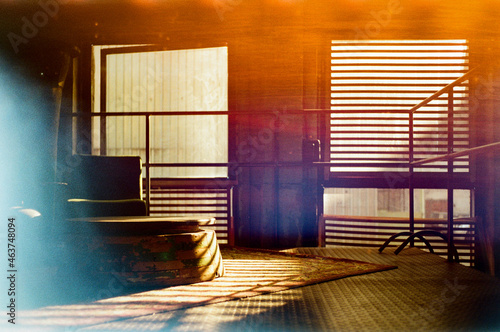 Inside an industrial old building with sun and shadows photo