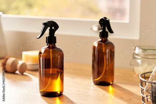 Natural cleaners in bottles in kitchen photo