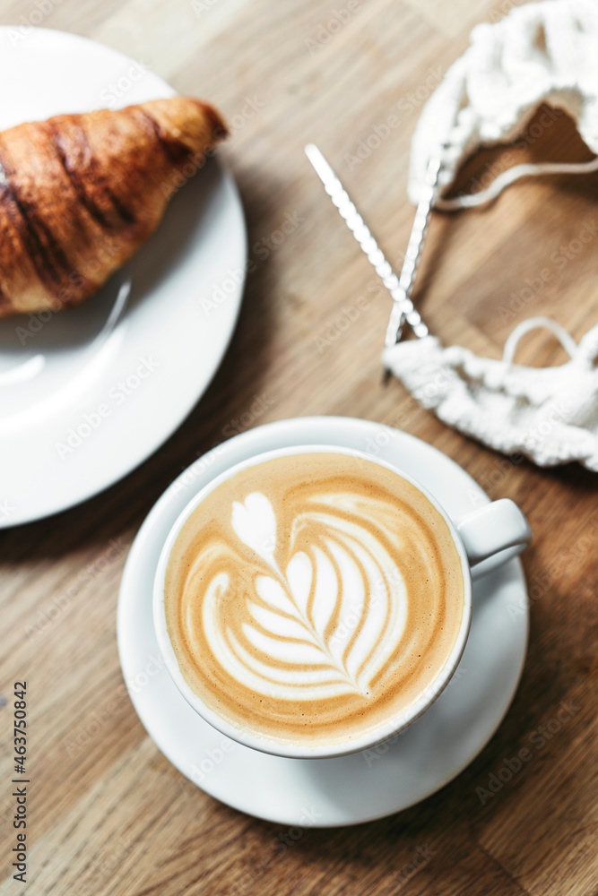 Breakfast with a cup of cappuccino on the table. Breakfast with a cup of cappuccino on the table.
