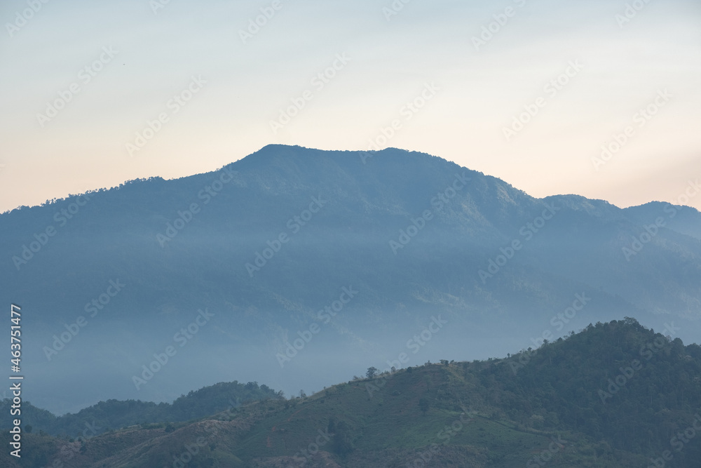 Surreal landscape of morning foggy..Morning clouds at sunrise.Landscape of fog and mountains of northern laos