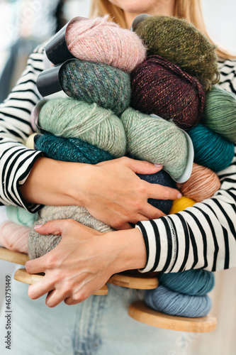 An anonymous female knitter with yarn in her hands. photo