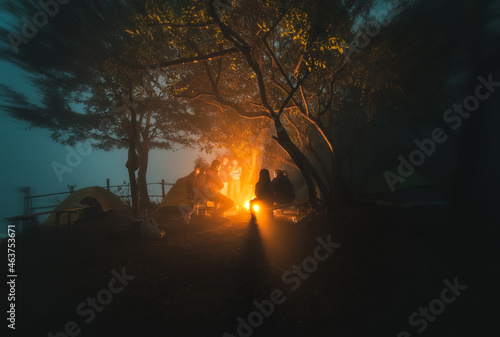 Camping with friends in the night 