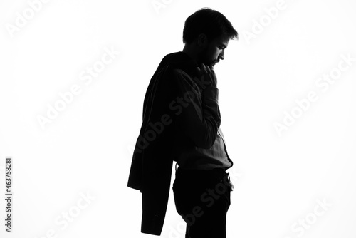 Man with a pistol in hand crime hand gesture light background