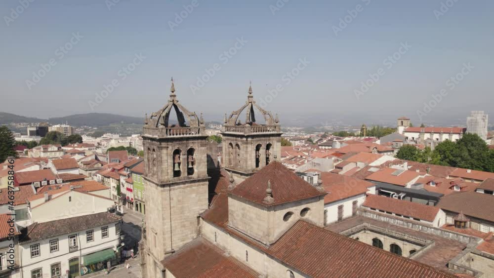Aerial circular view of Braga historical center with focus on cathedral bell towers and roofs. Portugal. Slow motion Aerial circular view of Braga historical center with focus on cathedral bell towers and roofs. Portugal. Slow motion