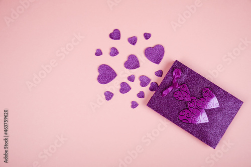 Happy Valentine's Day flatlay. Top view present gift box, hearts, glasses on on yellow color of the year 2021 background background. Valentine day or New Year greeting card © Irina Schmidt