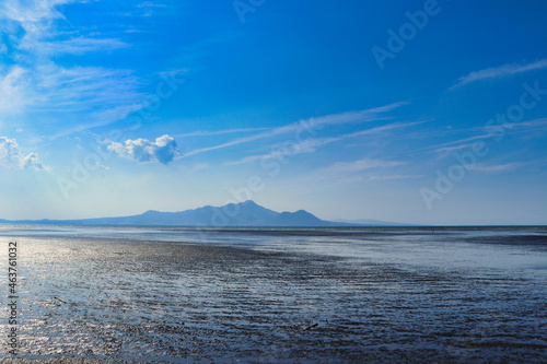 Tidal flat and clouds and blue sky