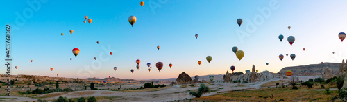 Panoramic view of Cappadocia with lots of hot air balloons on the air
