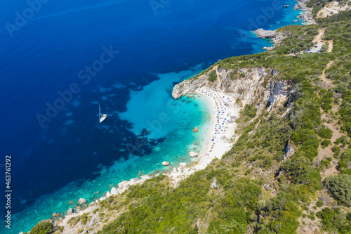 Fototapeta Naklejka Na Ścianę i Meble -  Aerial drone photo of iconic paradise sandy beach of Agiofili near port of Vasiliki with emerald crystal clear sea and sail boats docked, Lefkada island, Ionian, Greece