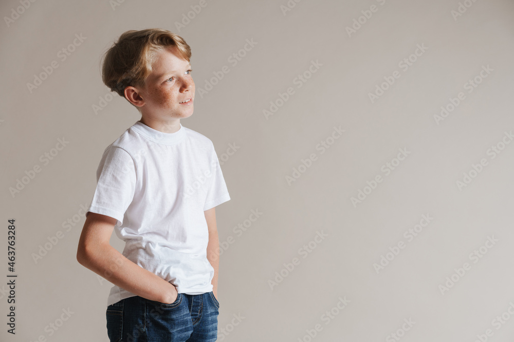 Portrait of a casual preteen boy in t-shirt standing Portrait of a casual preteen boy in t-shirt standing