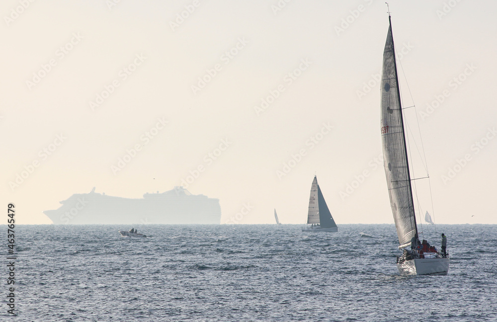 Cruise ship and sailboat