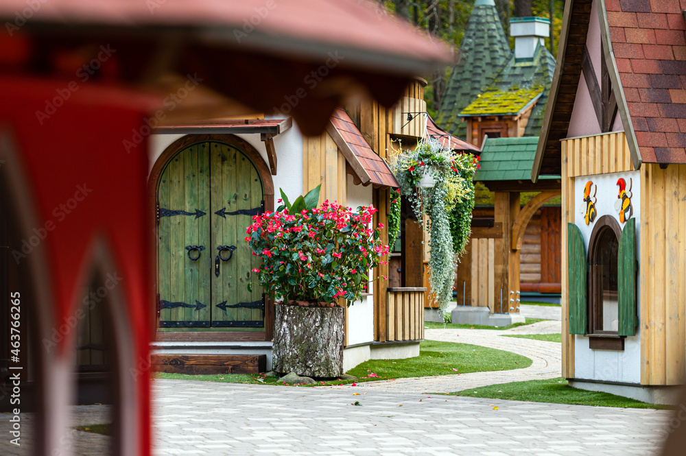 gnome village in attraction park, tiny dwarf houses with colorful facades, fairy tale village