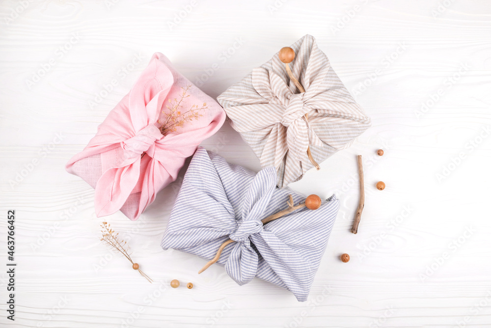 Christmas furoshiki wrapping. Zero waste concept. Flat lay. Christmas furoshiki wrapping. Zero waste concept. Flat lay.