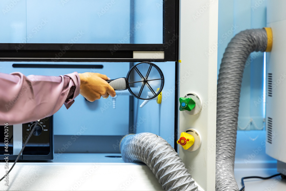 Hand holding Anemometer handheld digital wind speed meter gauge