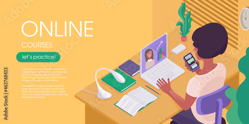 A woman is studying at home. The student is sitting at a desk, looking at the laptop screen, and chatting with a teacher online.