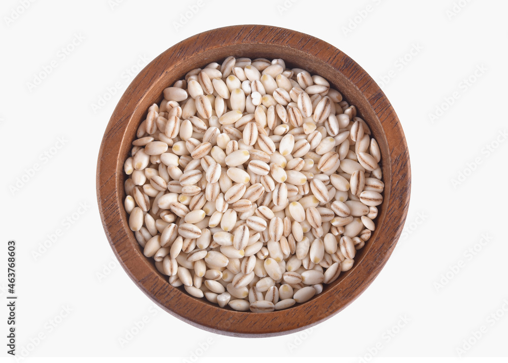 barley rice in wooden bowl on wooden background.