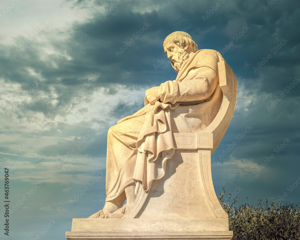 Plato, the ancient Greek philosopher marble statue under dramatic sky, Athens Greece