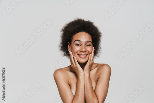 Black brunette woman smiling and looking at camera