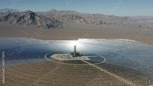 4K large industrial Solar Energy Farm producing concentrated solar power at Nipton, desert on boarder of California and Nevada, USA. Huge solar fields of innovative renewable energy sourcing photo