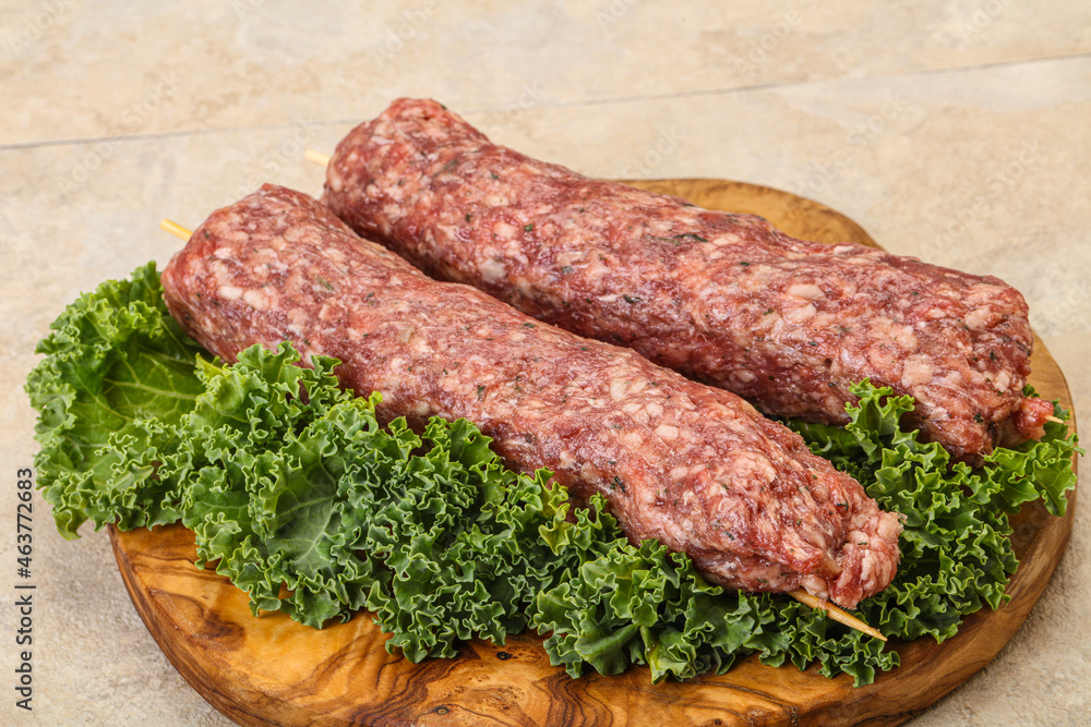 Raw minced beef kebab skewer