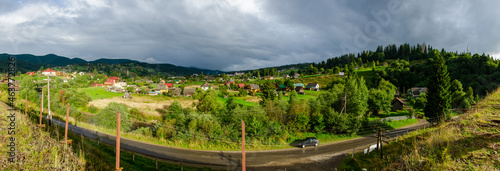 Panorama of the Carpathian mountains in autumn landscape with grass  trees  sky