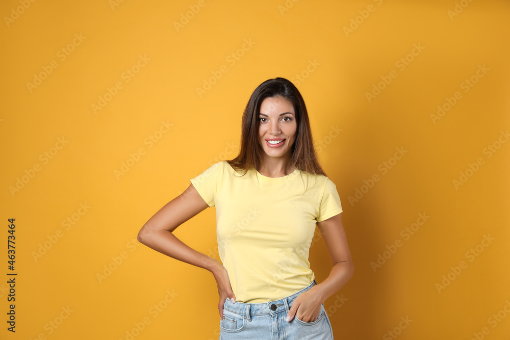 Portrait of beautiful woman on yellow background Portrait of beautiful woman on yellow background