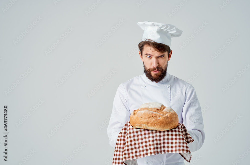 male cook with bread in hand Professional emotions male cook with bread in hand Professional emotions