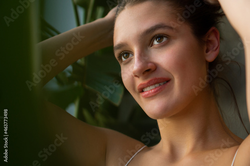 Close-up portrait of a beautiful young caucasian woman with natural brown hair.