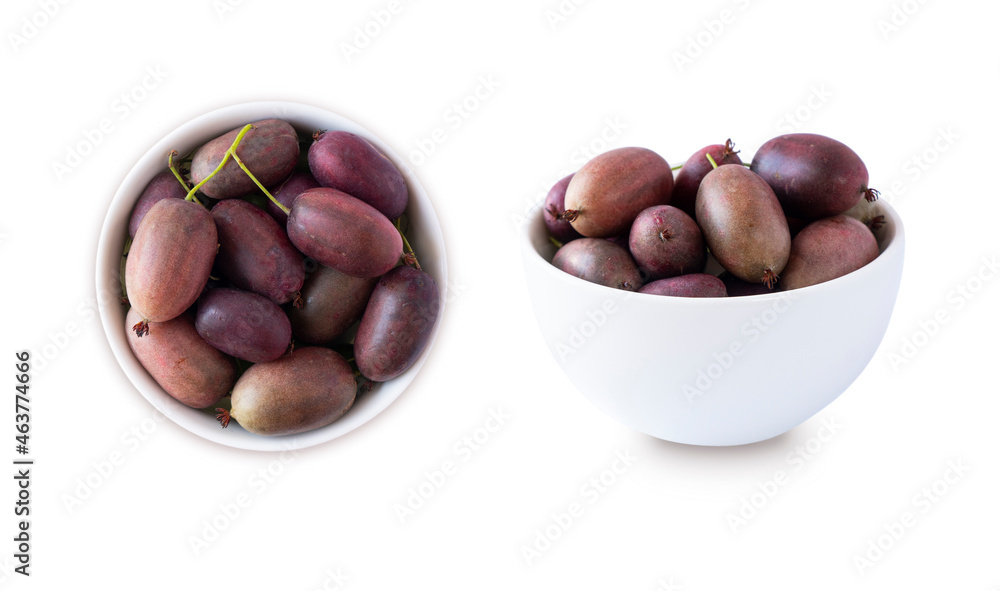 Actinidia isolated on white background. Actinidia in a bowl with copy space for text. Kiwi fruit actinidia. Baby kiwi fruits in a bowl from different angles.Top view Actinidia isolated on white background. Actinidia in a bowl with copy space for text. Kiwi fruit actinidia. Baby kiwi fruits in a bowl from different angles.Top view