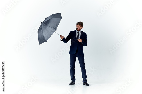 business man in a suit umbrella overhead protection