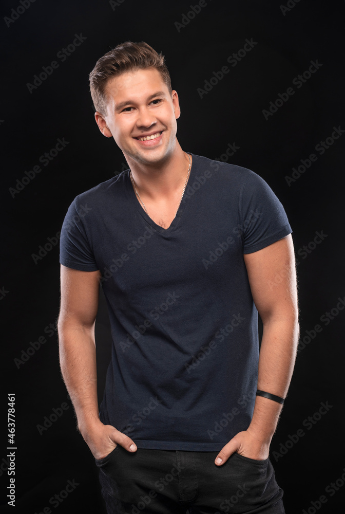 Portrait of smiling handsome man posing in studio Portrait of smiling handsome man posing in studio