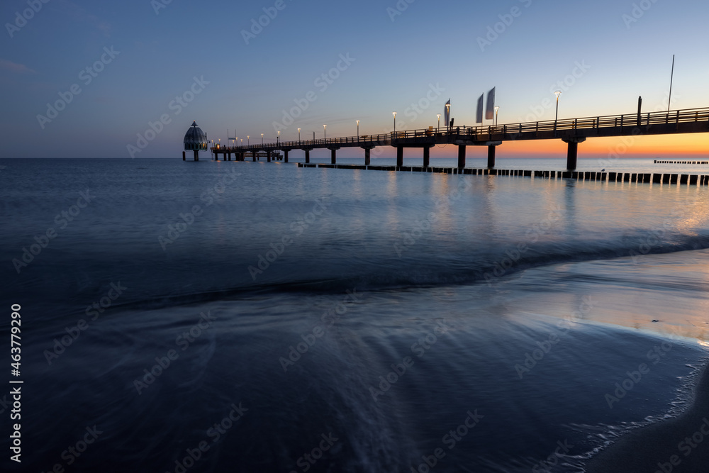 Sunrise at the beach at baltic sea with pier, Zingst, Western-Pomerania, Germany
