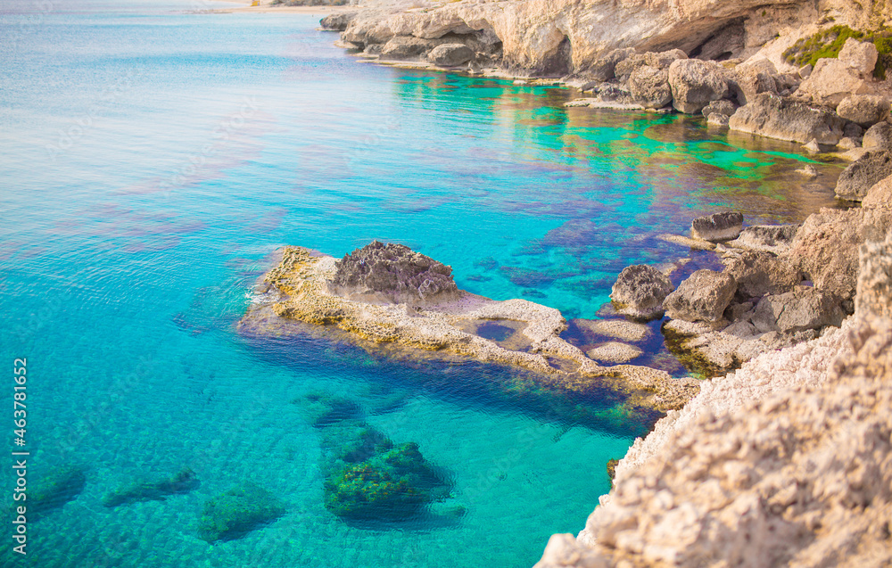 Beautiful picturesque cliffs of Ayia Napa in Cyprus. Arch Bridge of lovers. On the Mediterranean coast, background with a beautiful rock texture as a concept for travel and tourist excursions.