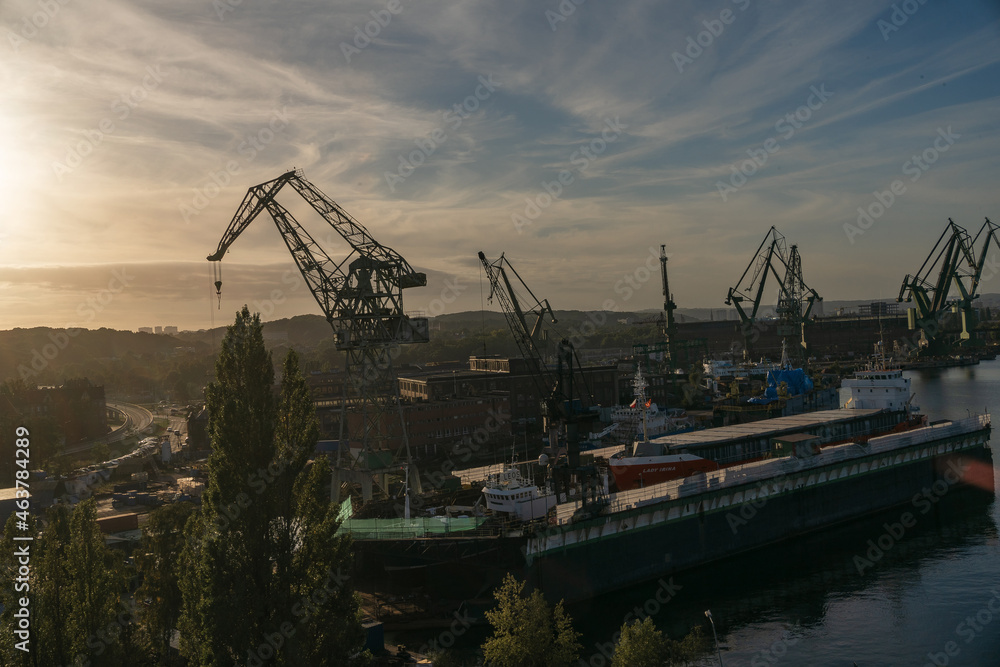 Gdansk, Poland. 2021 Old shipbuilding company. Cranes for the construction of boats. On the Sunset. Gdansk, Poland. 2021 Old shipbuilding company. Cranes for the construction of boats. On the Sunset.
