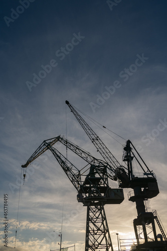 Gdansk, Poland. 2021 Old shipbuilding company. Cranes for the construction of boats. On the Sunset.