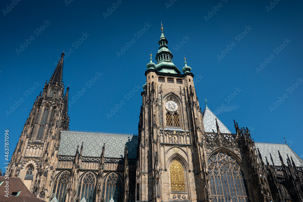 Prague Castle and Saint Vitus Cathedral, amazing architectural details and a great construction photographer during a sunny summer day. Landmarks of Europe. Travel photography.