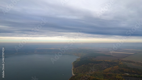 Autumn view on panorama of the Dniester River. landscape with canyon, forest and a river in front. beautiful nature scenery with cloudy sky and calm majestic river.