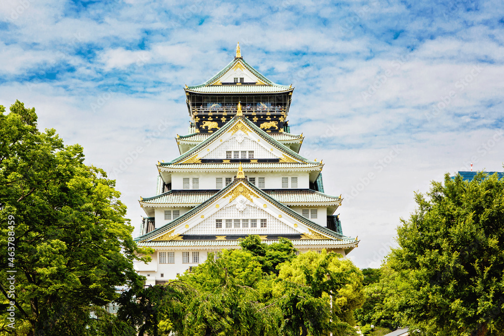 Beautiful Osaka castle in Japan on sunny summer day. Famous castle, attraction for tourists and sightseeing. Japanese culture. The castle is one of Japan's most famous landmarks. Beautiful Osaka castle in Japan on sunny summer day. Famous castle, attraction for tourists and sightseeing. Japanese culture. The castle is one of Japan's most famous landmarks.